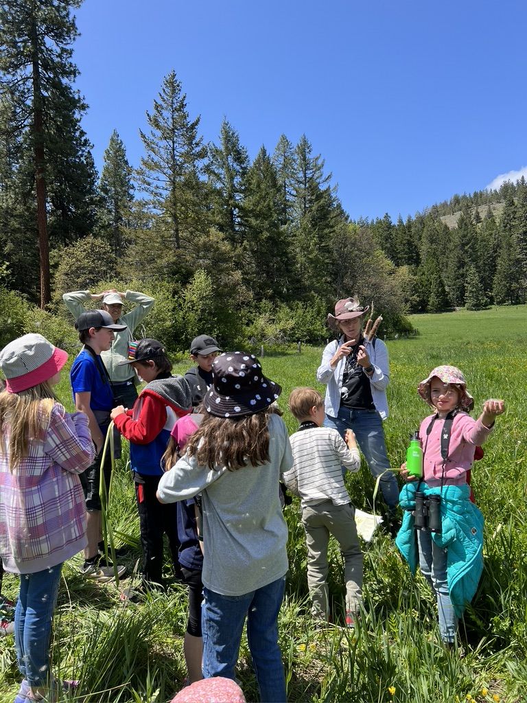 elementary school class field trip in meadow at The Crest at Willow-Witt Ranch