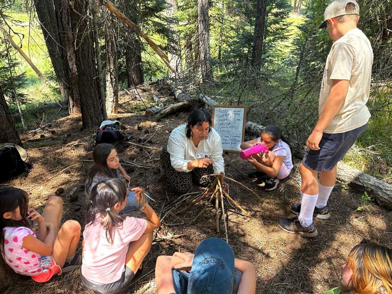 Nature Day Campers learn how to properly build a campfire