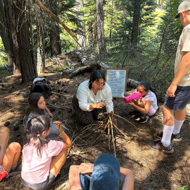 Education Director Liz talks to group of students on trail about western pond turtles