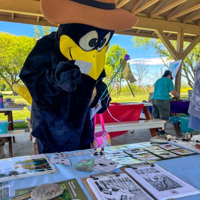Black Bird mascot visits our Earth Day event booth