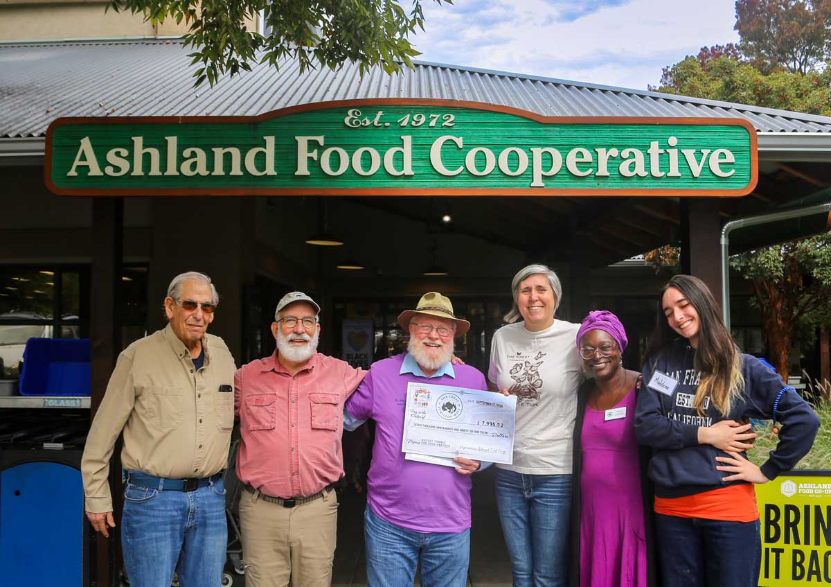 photo of The Crest receiving Change For Good check with Donors, CREST Board members, Crest staff and Co-op staff