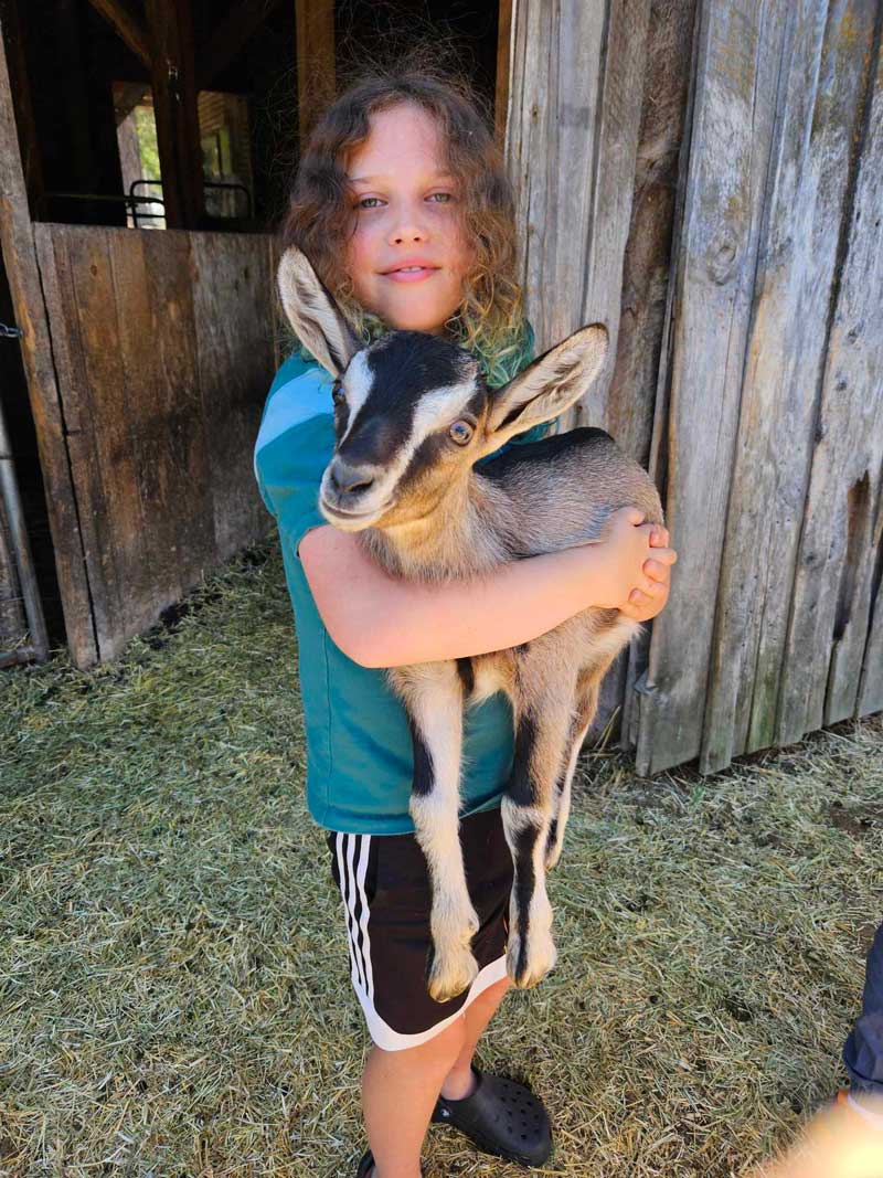 Camper Holding Baby Goat2