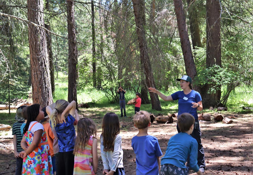 Sara explaining a game to her campers