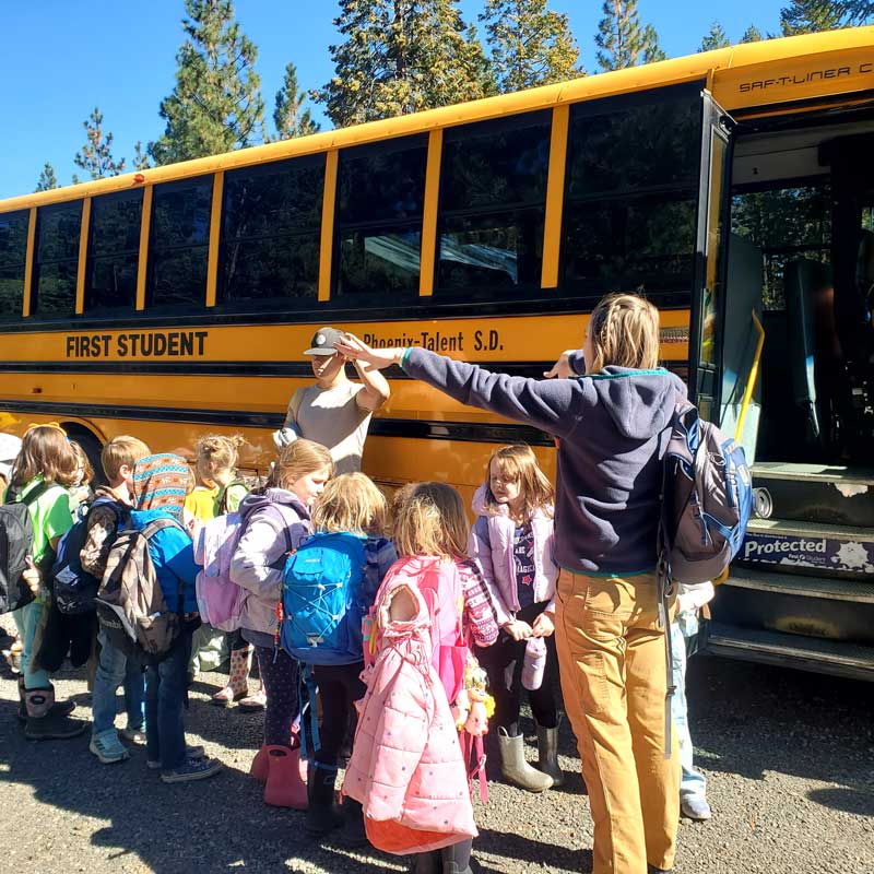 fall field trip students line up at school bus