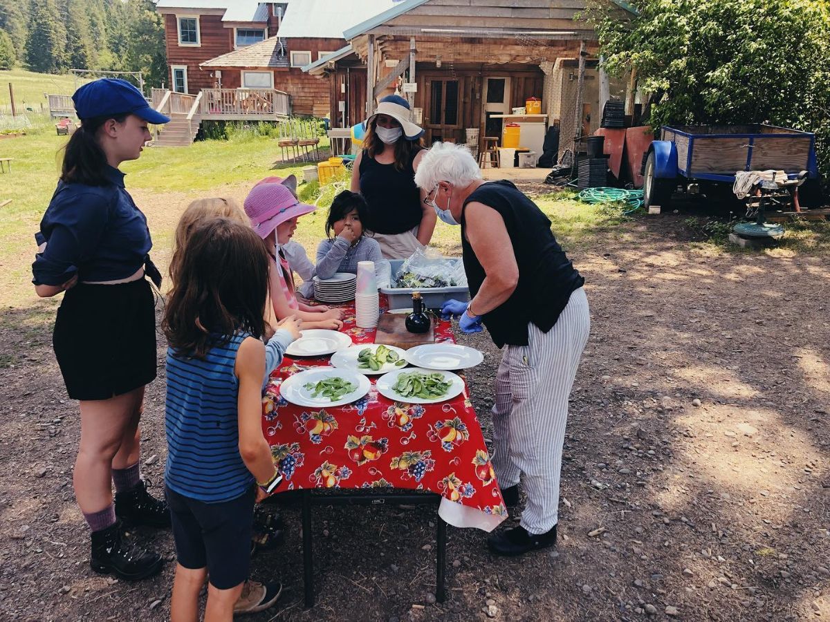 Lanita Witt oversees the summer camp veggie tasting table