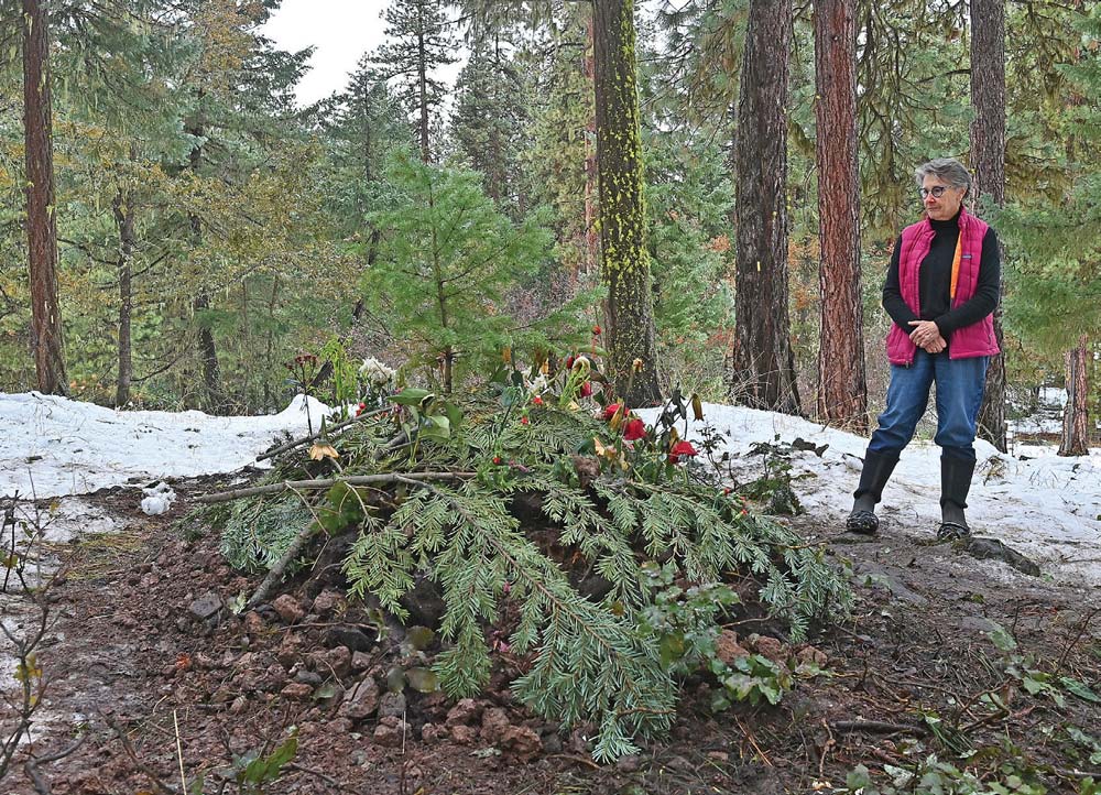 Suzanne Willow visits the gravesite of Dr. Lanita Witt at Willow-Witt Ranch on Thursday. Photo by Jamie Lusch, Mail Tribune.