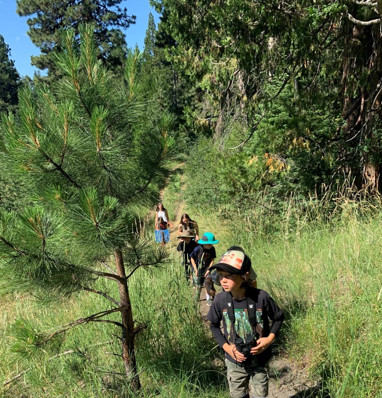 outdoor school students on a hike on the ranch