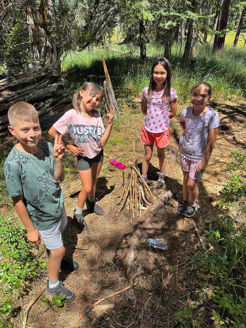 Outdoor School students display their fire building skills