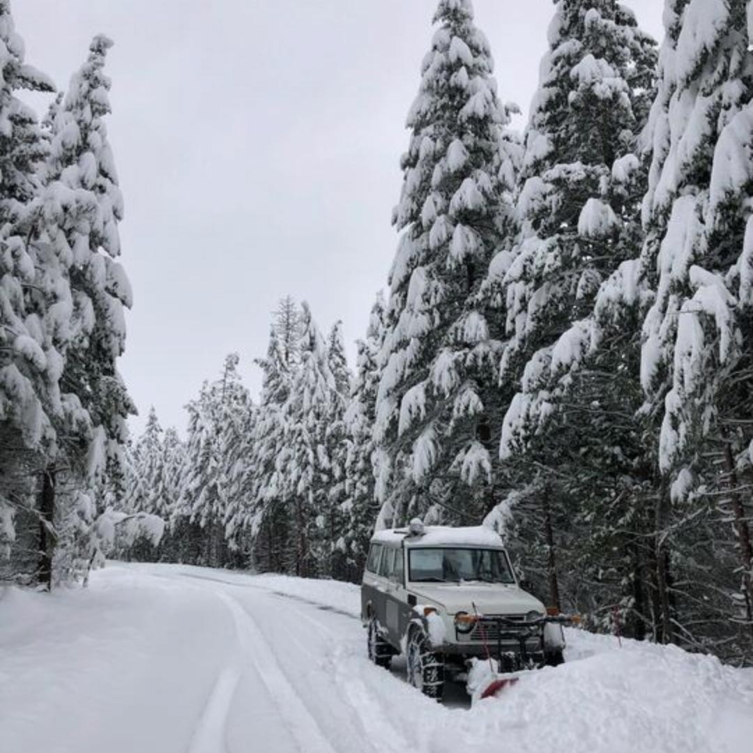 plowing snow off the road to the ranch