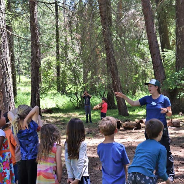 Sara explaining a game to her campers